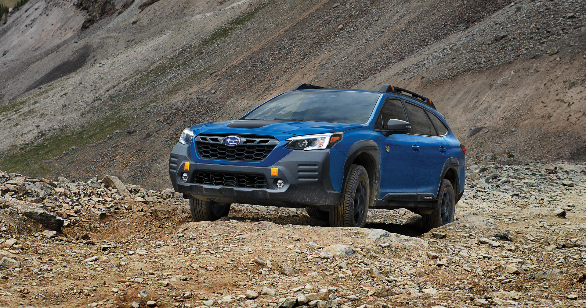 A 2023 Outback Wilderness driving on a trail in the mountains. | Dutch Miller Subaru in Charleston WV